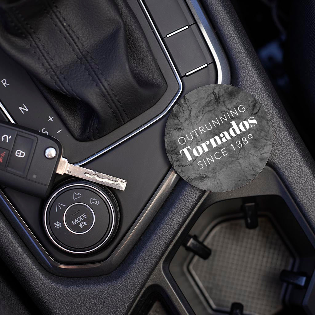 Car Coaster-Outrunning Tornados Since 1889